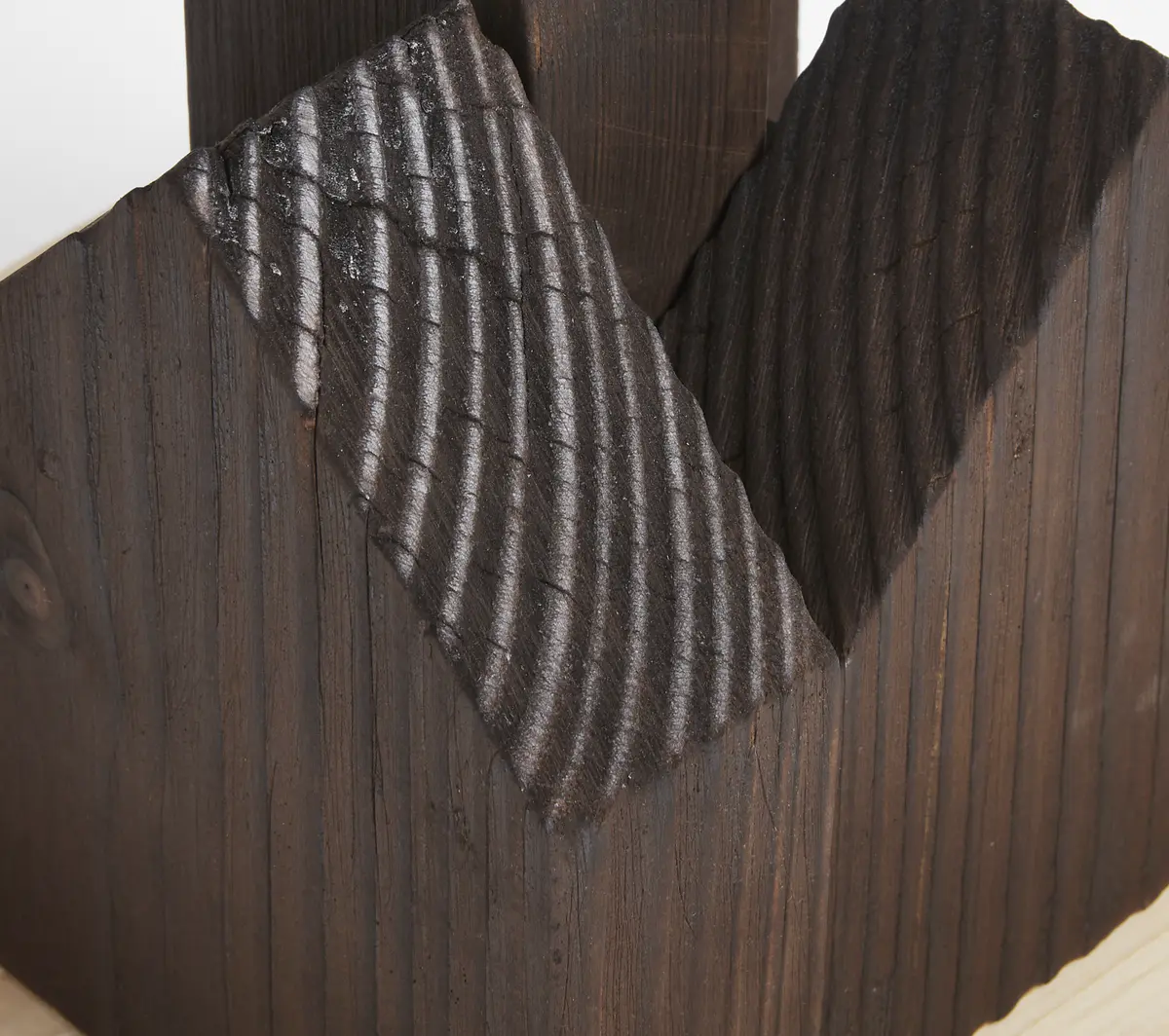 Lichen as bioindicators

Lichen Vs Carbon. These concept models look to document both the current state of Dudley Highstreet and the vision looking towards the future within this thesis project.

The lichen covered model looks towards a future in Dudley that is rich in texture, colour, nature and oxygen. Natural materials promote natural growth, and textures such as rough sawn timber and stone are the prefect hosts for lichen. All new buildings in Dudley would benefit massively from following a fabric first approach and adopt the use of sustainable and recycled building materials along with systems that use minimal energy.

The lichen model represents a vision for this thesis, buildings that are covered in natural materials and lichens that help sequester carbon and promote a healthier Highstreet. Suggestions of raised buildings also proposes less disruption to the ground and natural landscape, giving plants and animals the opportunity to thrive in an otherwise hostile concrete environment. Raised buildings also look towards a future planet with rising sea levels, future factors that will drastically affect the way we carry out daily lives and futureproofing all buildings for generations to come.

This second model uses the Shou Sugi Ban method of charring timber to waterproof it. In this case however it represents the embodied carbon and pollution within the highstreet as it exists now. The simplicity and repetition is also used to symbolise the plain nature of the highstreet with only a few materials exhibited, mainly brick & concrete. Once burnt the timber forms were brushed with wire wool to reveal the natural grain of the wood, a visual representation of degradation of layers of buildings that are built poorly or not constructed to last longer than a generation. - Michelle Gartside Model 9.png